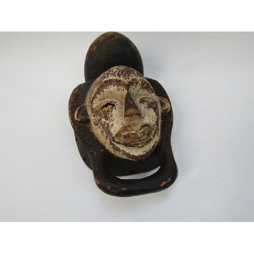 6188 - Two African masks with white painted faces, 33cm & 34cm tall