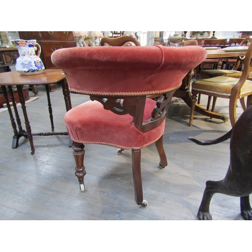 6190 - A 19th Century library tub chair with carved scroll splat, deep pink velour upholstery, turned legs ... 