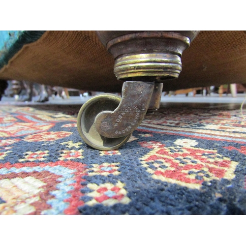 6195 - A Howard and Sons, London Victorian low deep seated armchair on castor feet,  7132/7160 marked on ba... 