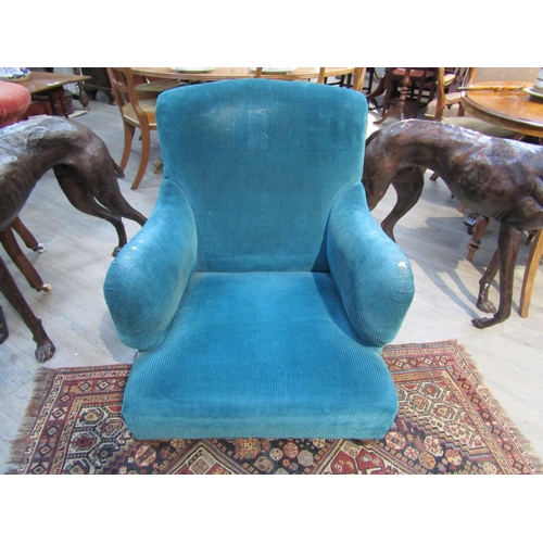 6195 - A Howard and Sons, London Victorian low deep seated armchair on castor feet,  7132/7160 marked on ba... 
