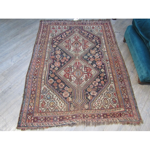 6196 - A Persian hand-knotted rug with central lozenge field, 150 cm x 110cm