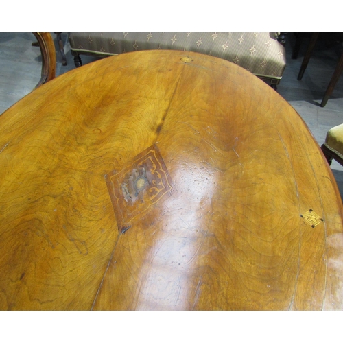 6202 - A Victorian walnut centre table with central diamond form lozenge, turned stem to quatraform base. T... 