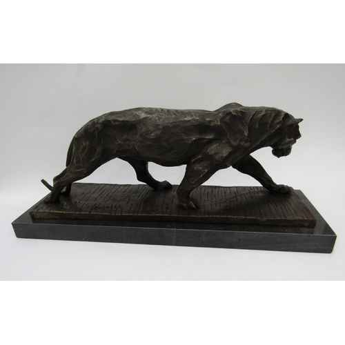 6218 - A bronze of a stalking panther on marble plinth, signed Bugatti, 52cm long