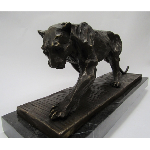 6218 - A bronze of a stalking panther on marble plinth, signed Bugatti, 52cm long