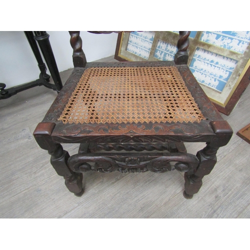 6271 - A Charles II walnut crinoline chair with cane back and seat, barley twist supports all over carved d... 