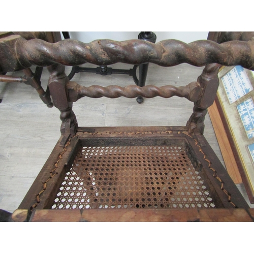 6271 - A Charles II walnut crinoline chair with cane back and seat, barley twist supports all over carved d... 