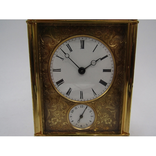 6225 - A French gilded carriage clock in gorge style case, fully engraved, with two keys