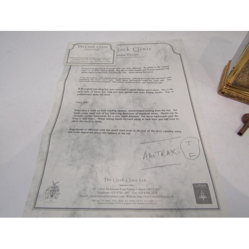 6225 - A French gilded carriage clock in gorge style case, fully engraved, with two keys