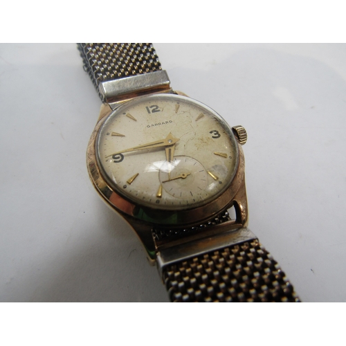 6245 - GARRARDS 1950's gents 9ct gold wristwatch with interesting Havilland propeller hands. Inscription to... 