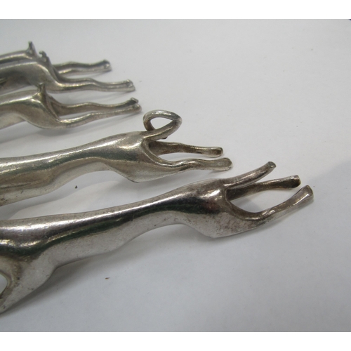 6246 - A set of twelve anamorphic knife rests including pigs, hares, stags and dogs    (C)