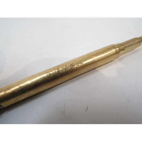 6268 - A gold propelling pencil, marks worn, inscribed Peter