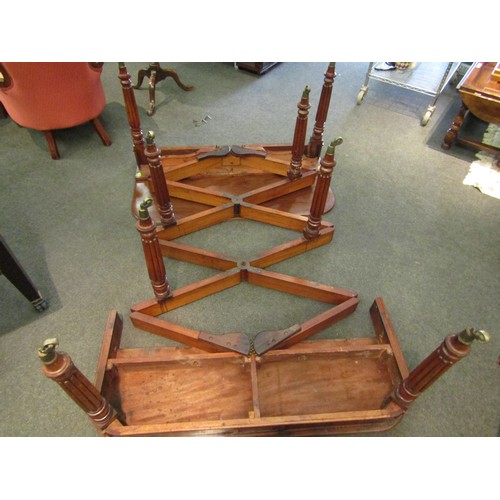 6197 - A Georgian mahogany concertina action extending dining table of rounded square form raised upon six ... 