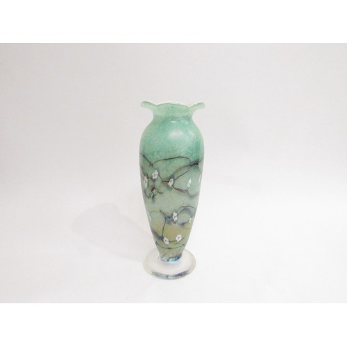 9198 - An Okra Glass tall vase in mottled green with floral cane insets and dark striations, white interior... 