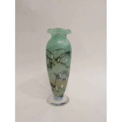 9198 - An Okra Glass tall vase in mottled green with floral cane insets and dark striations, white interior... 