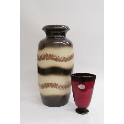 9007 - A West German Pottery floor vase in brown and cream banding, No. 291-45 to base, 45cm high. Together... 