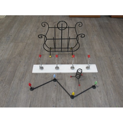 9327 - An Atomic/Sputnik style 1950's candle holder, magazine rack and two 1960's wall mounting coat racks.