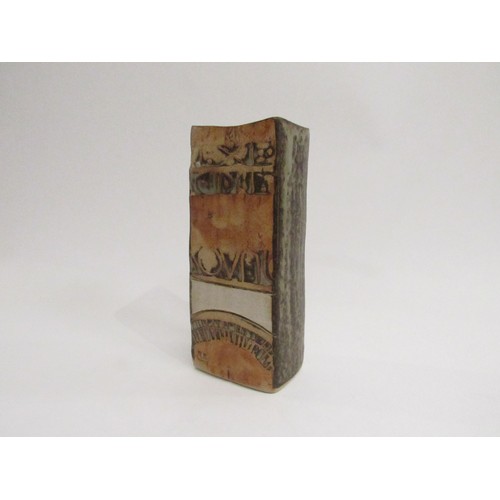 9101 - A Louis Hudson studio pottery slab vase, relief moulded abstract design. Impressed mark, 18cm high