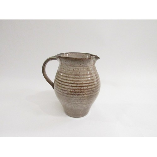 9088 - DAVID LEACH (1911-2005): A Studio Pottery jug in speckled brown glazes. Impressed seal, 17cm high