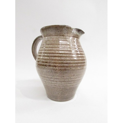 9088 - DAVID LEACH (1911-2005): A Studio Pottery jug in speckled brown glazes. Impressed seal, 17cm high