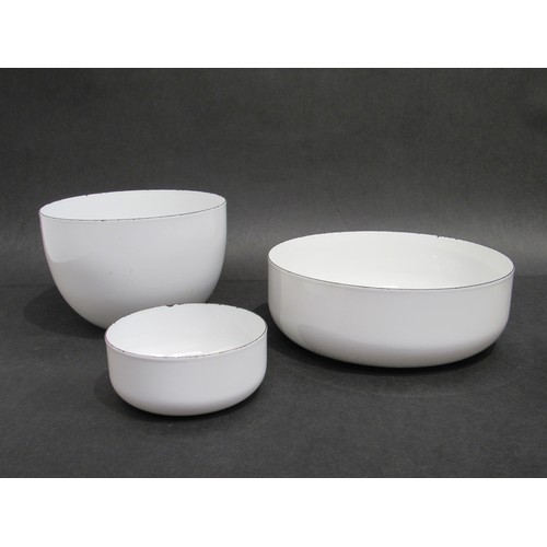 9264 - A set of three Mid Century Scandinavian white enamel bowls, largest 26cm diameter, tallest 14cm