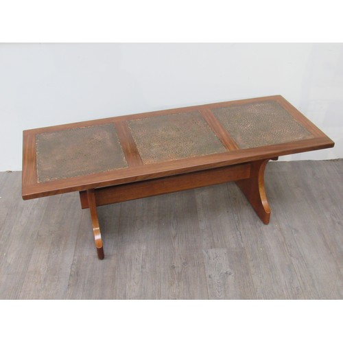 9303 - A G-Plan hardwood coffee table with inset beaten copper panel top, 131.5cm x 52cm x 46cm high      (... 