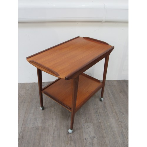 9345 - A Remploy teak two tiered trolley raised on castors, 75cm x 44cm x 69cm high