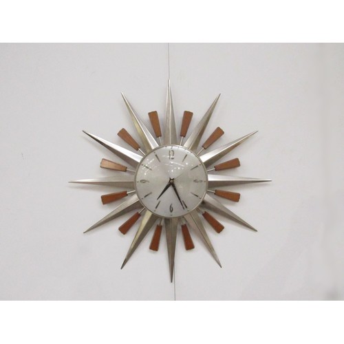 9247 - A Metamec Sunburst wall clock with teak and brassed finish detail, 59cm diameter