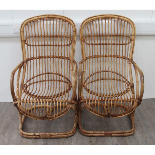 9314 - A pair of 1970's Italian bamboo cantilever chairs by Tito Agnoli for Bonacina. 106cm high