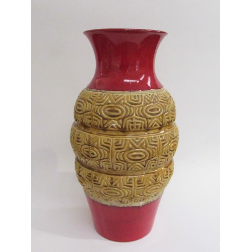 9008 - A West German Fat Lava Pottery vase in red with central relief moulded bands of geometric shapes in ... 