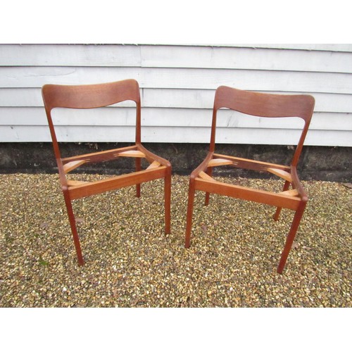 9287 - A pair of Danish teak dining chairs, seat pads removed as do not conform with current Fire Safety Re... 