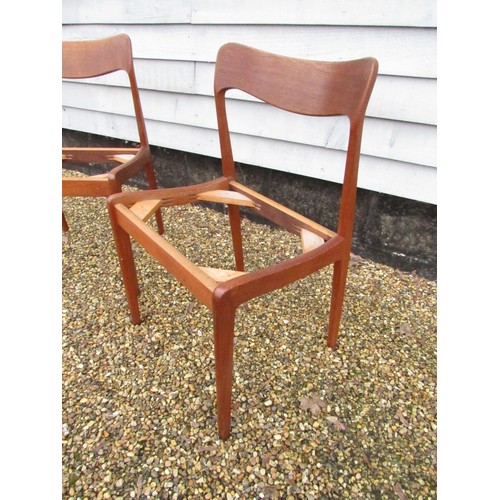 9287 - A pair of Danish teak dining chairs, seat pads removed as do not conform with current Fire Safety Re... 