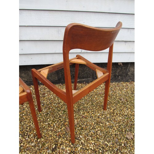 9287 - A pair of Danish teak dining chairs, seat pads removed as do not conform with current Fire Safety Re... 