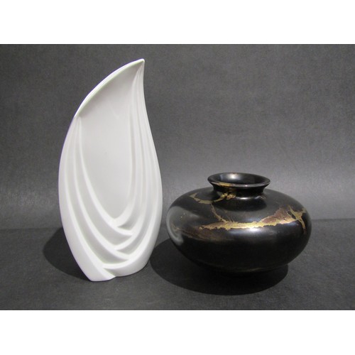 9079 - TONY LAVERICK (b.1961) Two items of pottery including a white glazed vase, 24cm high and black and g... 