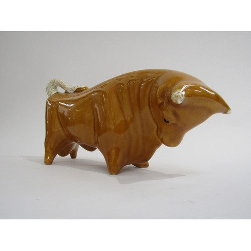 9040 - A Trentham bull designed by Colin Melbourne finished in unusual honey colour.   29cm long x  15cm hi... 