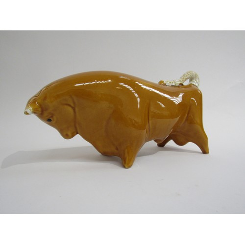 9040 - A Trentham bull designed by Colin Melbourne finished in unusual honey colour.   29cm long x  15cm hi... 