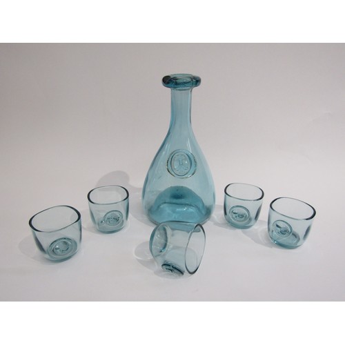 9148 - An Ole Winter Holmegaard glass carafe and five glasses in pale blue, decanter 23cm high