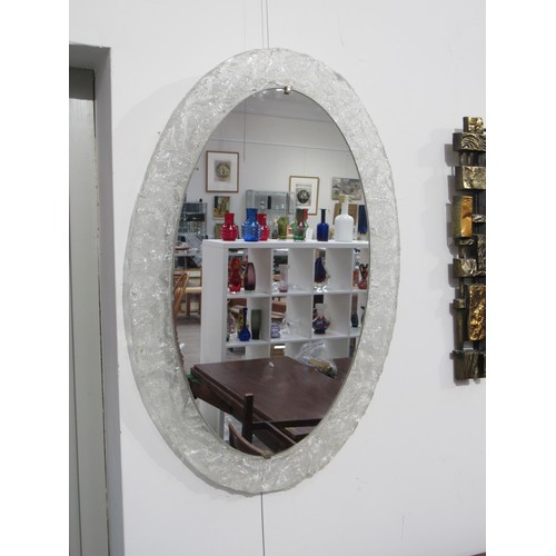 9337 - An oval mirror lucite frame manner of German Hillebrand, 60's/70's. 71cm x    48cm