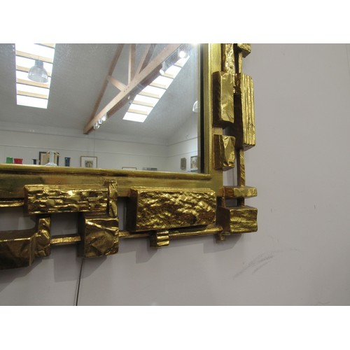 9340 - A Syroco brutalist mirror, mark to reverse frame, overall size 107cm x 50cm     (R) £150