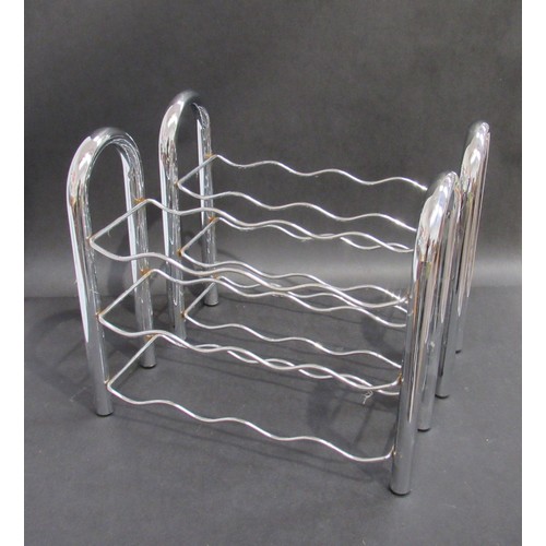 9309 - A pair of tubular chrome plated metal wine racks. 44cm x 39cm high