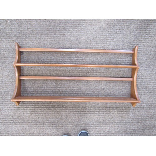 9318 - An Ercol light elm wall shelf, 96cm x 50cm