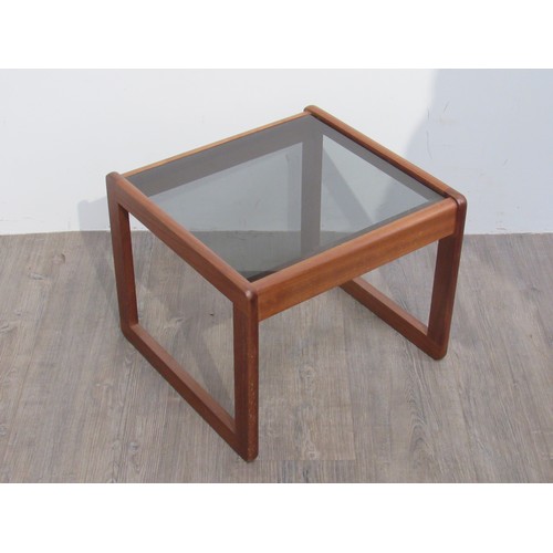 9368 - A teak occasional table with a smoked glass top, 45cm x 43cm x 36cm high