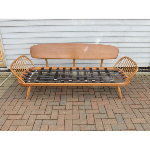 9346 - An Ercol light elm sofa 