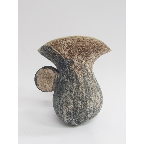 9082 - A Troika style studio pottery jug of abstract form and rough textured body, unmarked. 17cm high