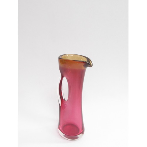 9217 - A Studio art glass large cased Sommerso style jug in cranberry and amber colours, indistinctly signe... 