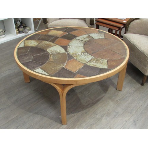 9275 - A Danish circular coffee table with stoneware tiled top by Haslev and laminated ply frame. Marks to ... 