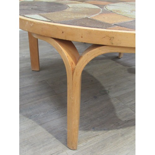 9275 - A Danish circular coffee table with stoneware tiled top by Haslev and laminated ply frame. Marks to ... 