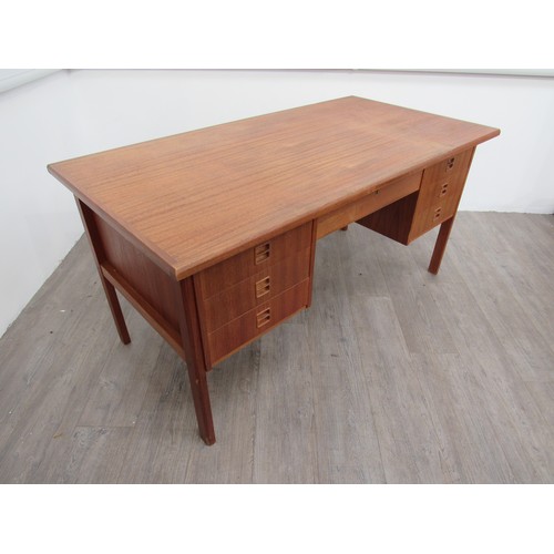 9286 - A Danish teak twin pedestal desk with seven drawers, open 'book shelf' back. 146cm x 76cm x 72.5cm h... 