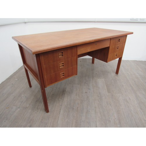 9286 - A Danish teak twin pedestal desk with seven drawers, open 'book shelf' back. 146cm x 76cm x 72.5cm h... 