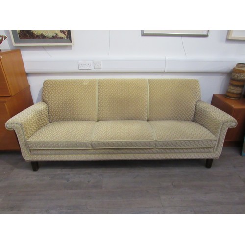 9317 - A 1940's Danish three seater sofa with original pale gold embossed upholstery, raised on dark staine... 