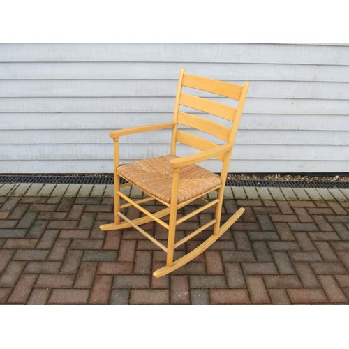 9354 - A Danish beech rocking chair with woven rush seat